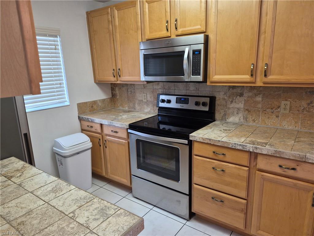 Image 3: Tile counter tops..