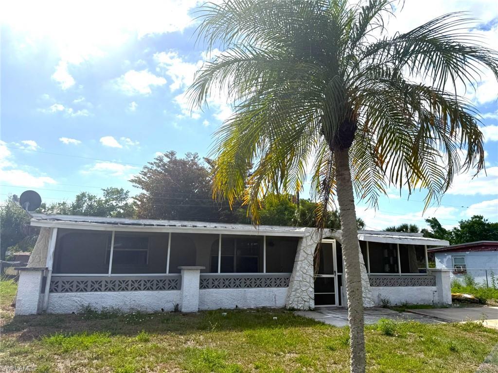Image 1: Front View of House. Fenced Yard