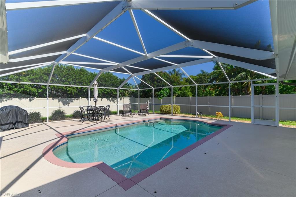 Image 3: Spacious Pool Deck and Fully-Fenced Backyard