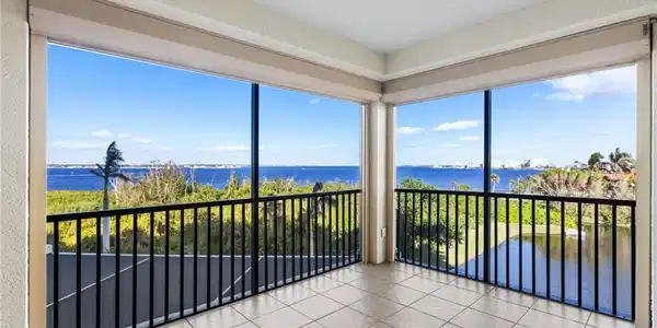 Image 3: UNOBSTRUCTED  views of the Caloosahatchee River from your screened in lanai. No building beside you in this condo.