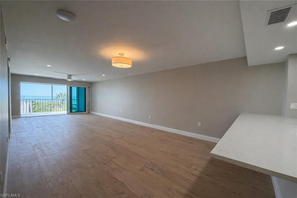 Image 3: Unfurnished living room featuring recessed lighting and light wood-style flooring