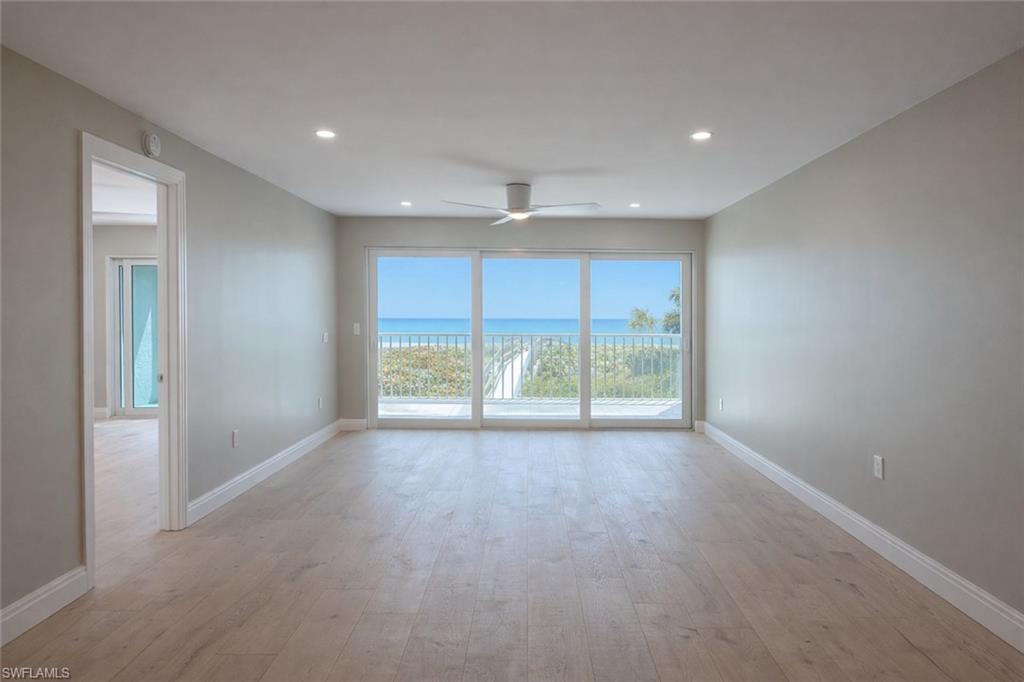 Image 4: Unfurnished room featuring light wood-style flooring, ceiling fan, recessed lighting, and a water view
