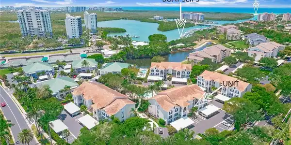 Image 4: Aerial view of property and surrounding area with a nearby body of water and nearby urban area