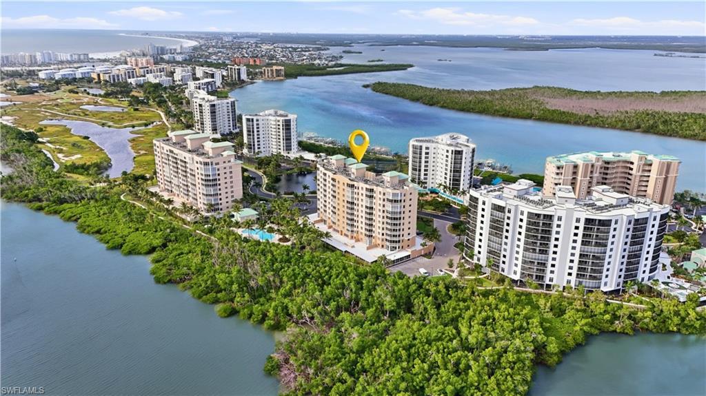Image 4: View of area featuring a nearby Lagoon and Bay and apartment complex - Virtually Edited Image