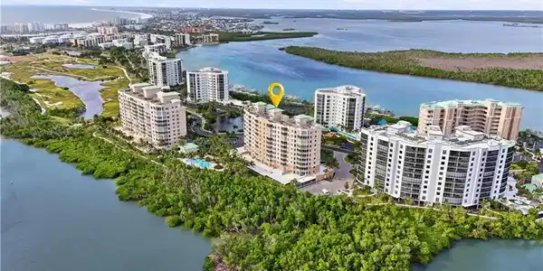 Image 4: View of area featuring a nearby Lagoon and Bay and apartment complex - Virtually Edited Image
