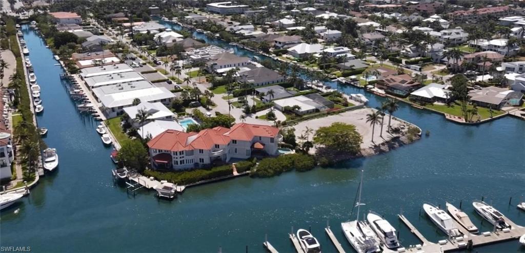 Image 2: Aerial view Slip C-7 in Curlew Canal at The Naples Bay Resort, leading out to Naples Bay
