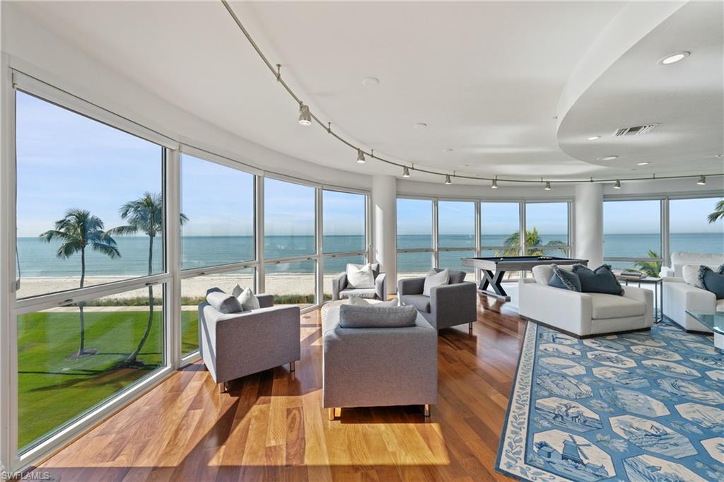 Image 4: Sunroom / solarium featuring a water view and track lighting