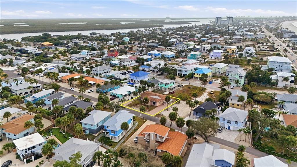 Image 3: Aerial view of residential area featuring a large body of water - Virtually Edited Image