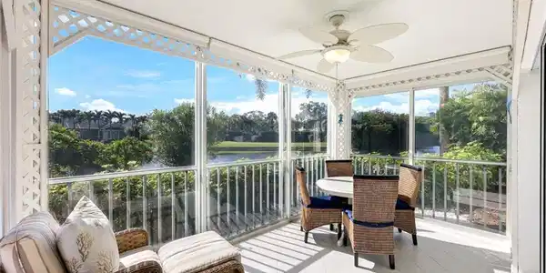 Image 2: Sunroom / solarium featuring ceiling fan, a water view, outdoor dining area, and a balcony