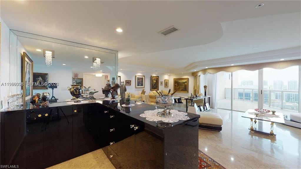 Image 4: Kitchen with open floor plan and recessed lighting
