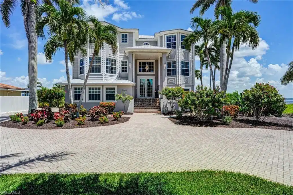 Image 1: View of front of home with stucco siding - Virtually Edited Image