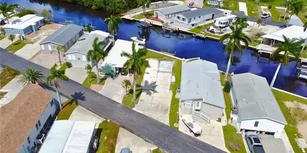 Image 4: Birds Eye view of lot with Gulf access canal- virtually enhanced