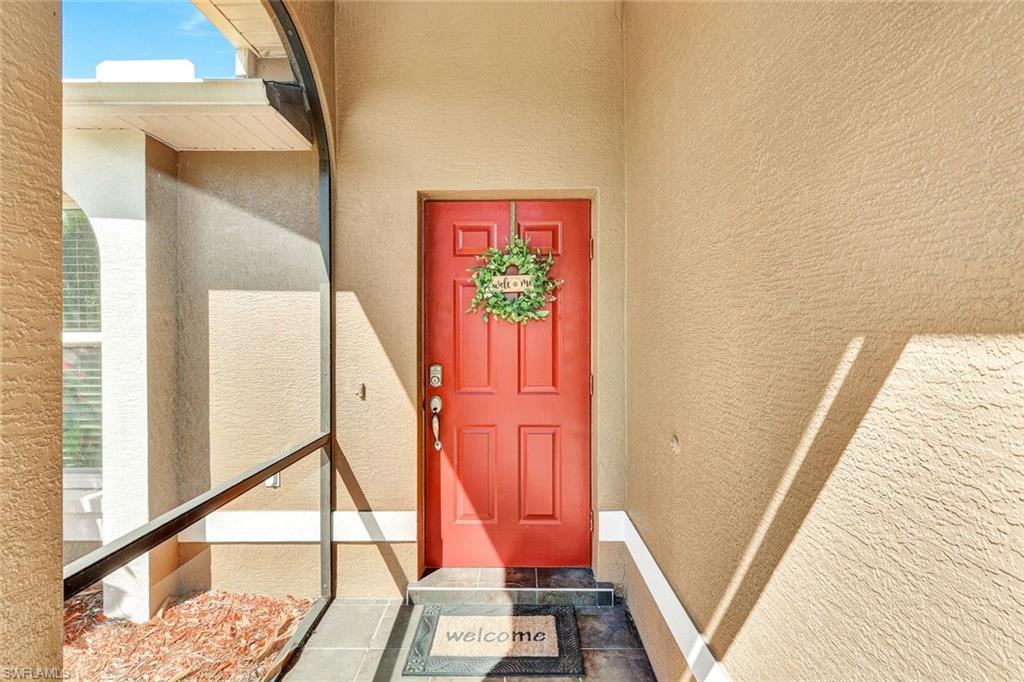 Image 4: View of exterior entry with stucco siding