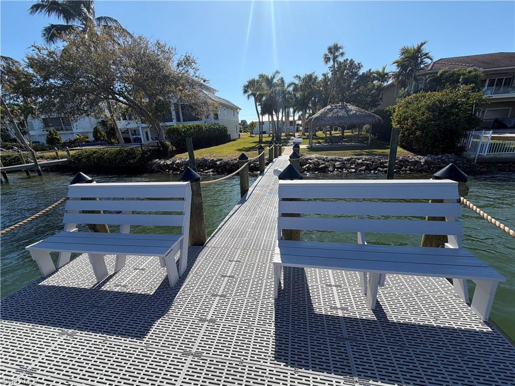 Image 3: Dock with a water view and a gazebo