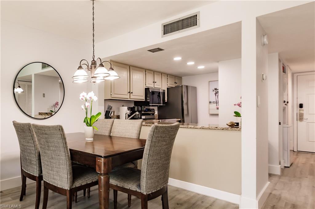 Image 3: Dining space featuring light wood-style floors, baseboards, visible vents, and recessed lighting