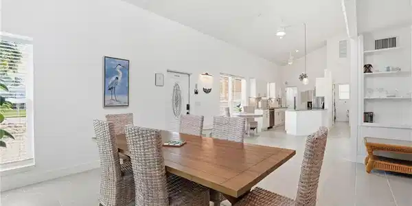 Image 3: Dining area and high vaulted ceiling- Virtually Edited Image