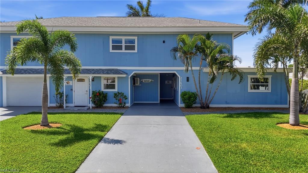 Image 3: Blue two-story exterior with white trim - Virtually Edited Image