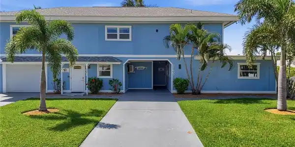 Image 3: Blue two-story exterior with white trim - Virtually Edited Image