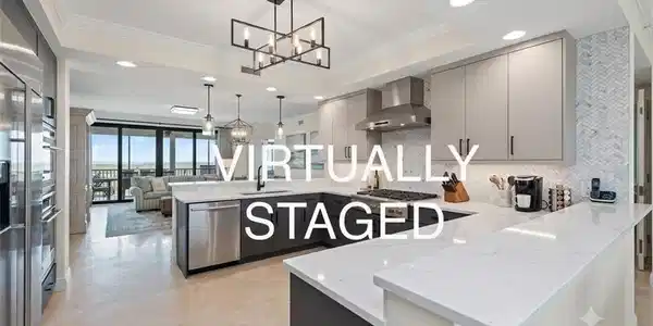 Image 4: Contemporary kitchen featuring a large island with white countertops, stainless steel appliances, herringbone tile backsplash, and light gray cabinetry