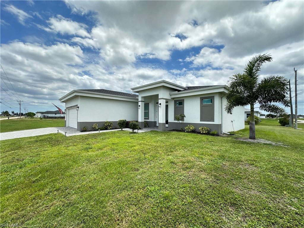 Image 2: Contemporary stucco exterior with a gray trim base