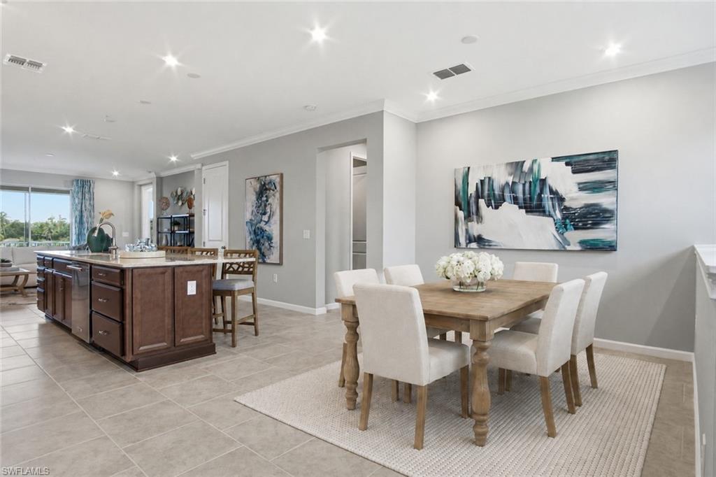 Image 2: Photo includes reality staging to showcase the possibility of the dining room. Design services included with purchase!