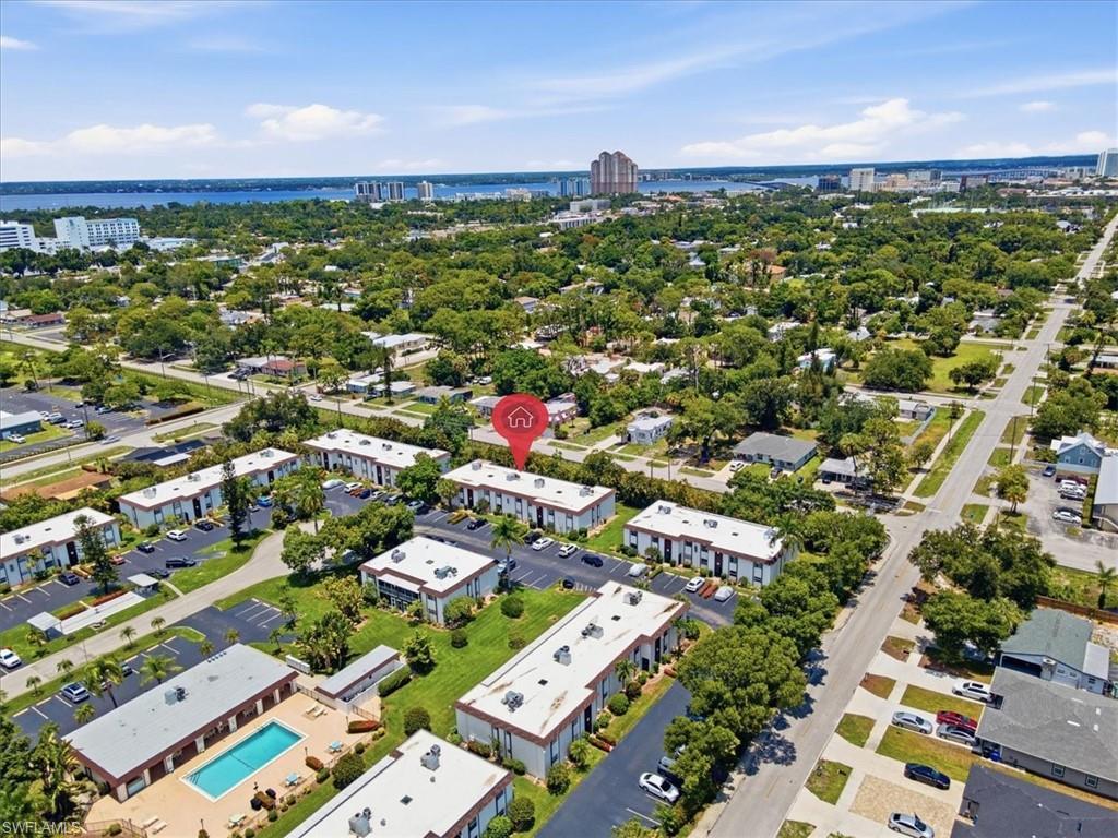 Image 2: Aerial perspective showcasing multiple residential buildings with surrounding green spaces