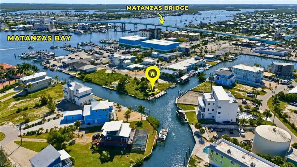 Image 1: Waterfront property featuring canal frontage, boat access, and proximity to Matanzas Bay - Virtually Edited Image