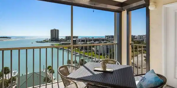 Image 4: Balcony with a water view and a ceiling fan