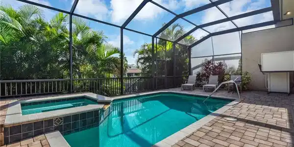 Image 2: Tranquil pool and hot tub area