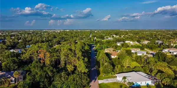 Image 4: Aerial view of property and surrounding area
