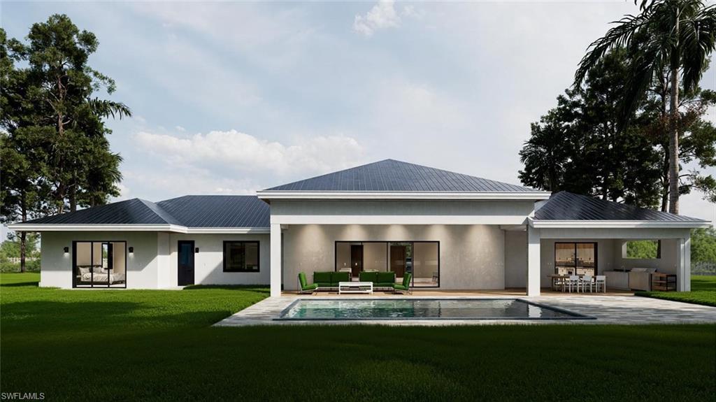 Image 2: Rear view of house featuring outdoor lounge area, a patio area, stucco siding, and a yard