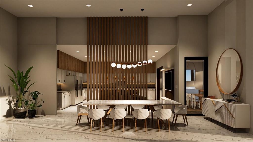 Image 3: Common area featuring recessed lighting and a towering ceiling