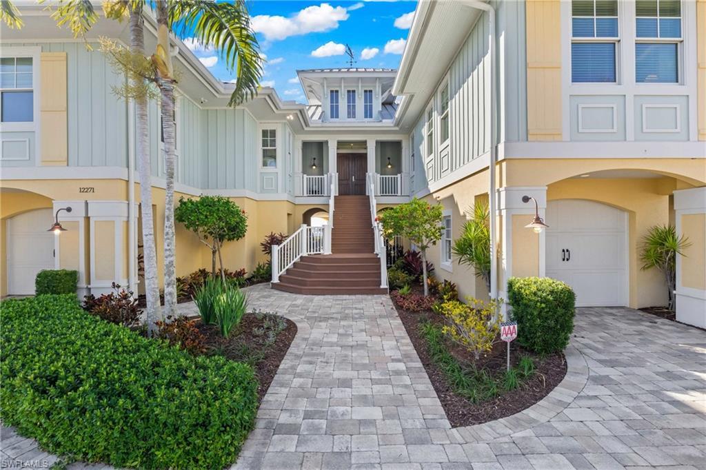 Image 2: The entry to this home is so inviting and the details are everywhere - weather vane on the rooftop, metal roof, trex deck stairs, designer korbels - this has it all!