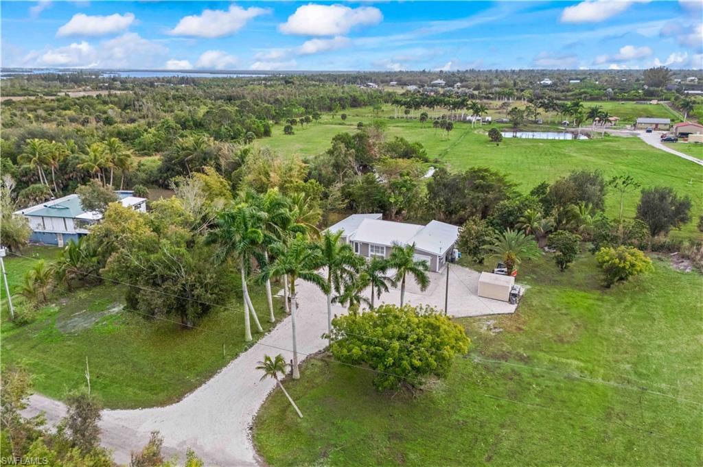 Image 3: Tucked away on over an acre, this gated Pine Island retreat offers peace, privacy, and space to breathe.