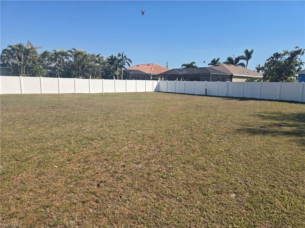 Image 3: View of yard featuring fence