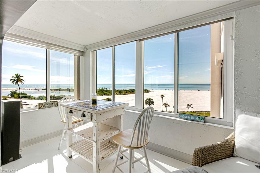 Image 2: Sunroom / solarium featuring a textured wall and a water view