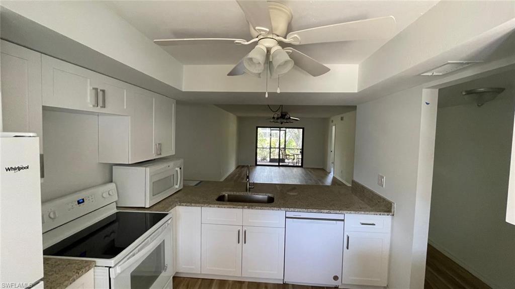 Image 3: Kitchen featuring white appliances