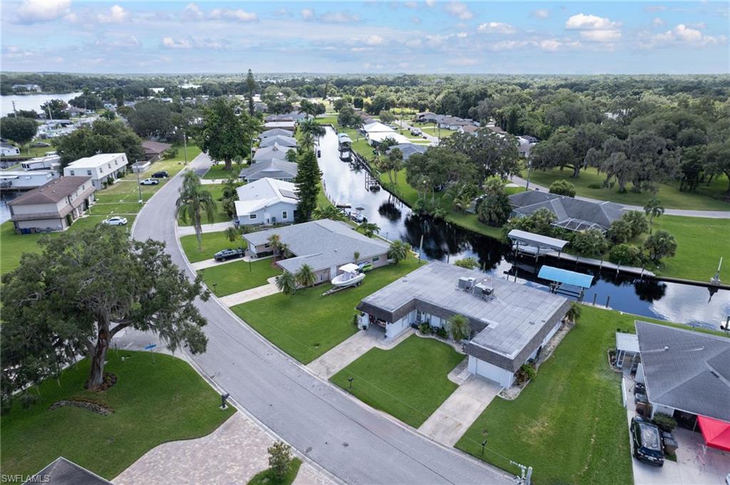 Image 2: View of property location with nearby suburban area and a nearby body of water