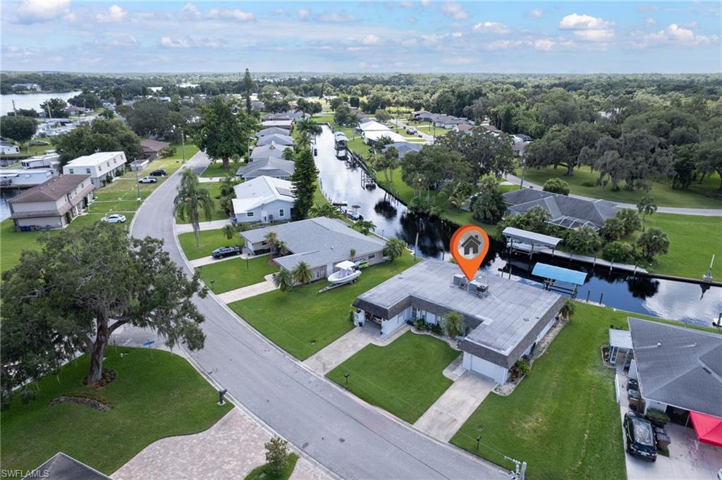 Image 3: View of property location with nearby suburban area and a nearby body of water
