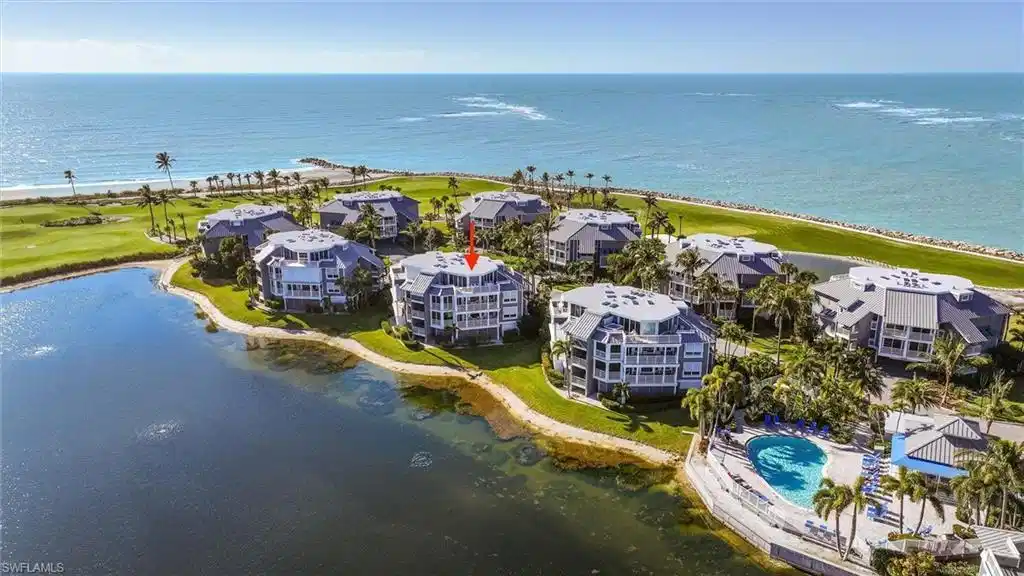 Image 1: Drone / aerial view of a nearby body of water and a golf course