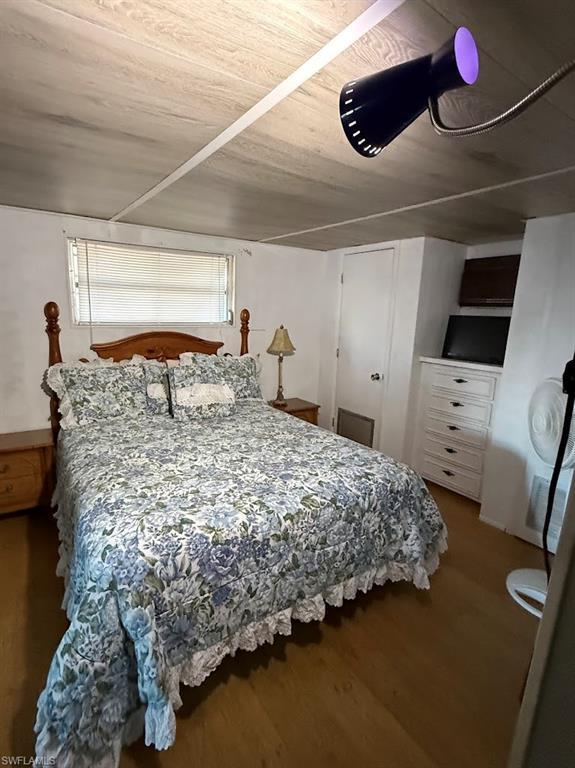 Image 4: Bedroom with wood finished floors