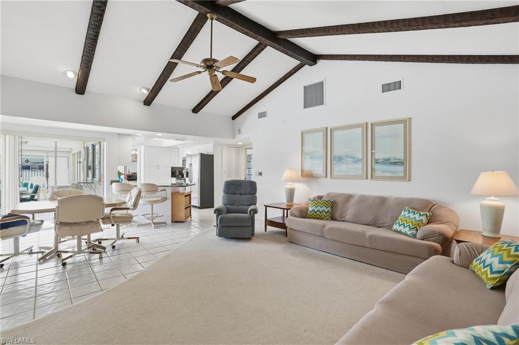 Image 3: Spacious family room opens up to Kitchen and dinette area.