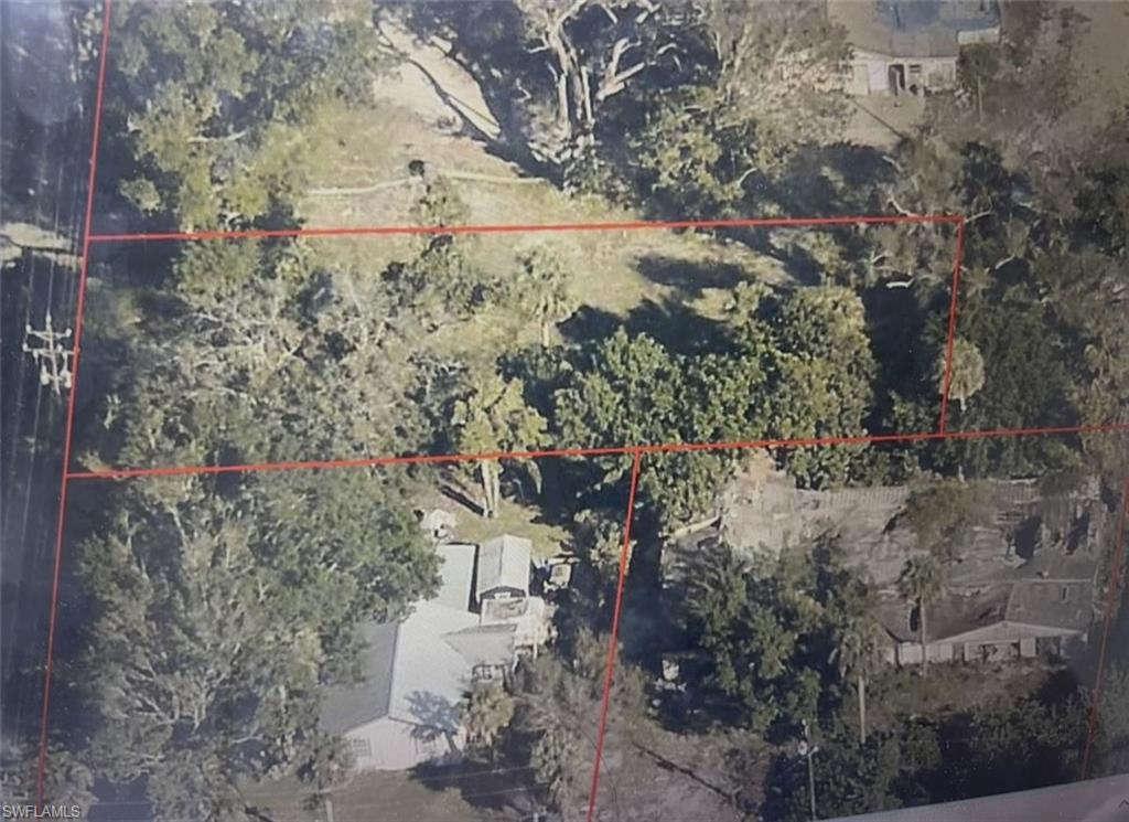 Image 1: Aerial view of property's location featuring property parcel outlined
