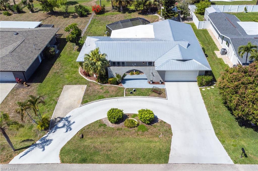 Image 2: Aerial view of property and surrounding area