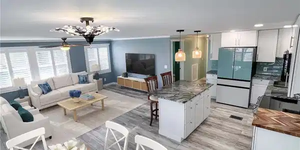 Image 3: Virtual staged dining, living and kitchen areas
