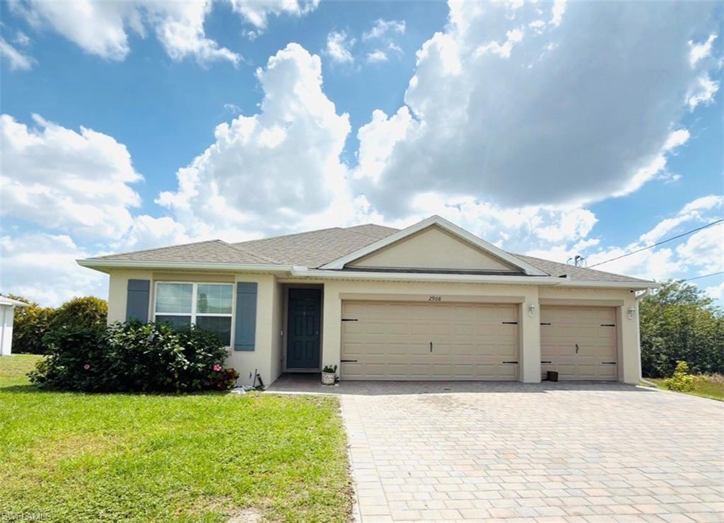 Image 1: Ranch-style home with an attached garage, stucco siding, decorative driveway, a front yard, and roof with shingles