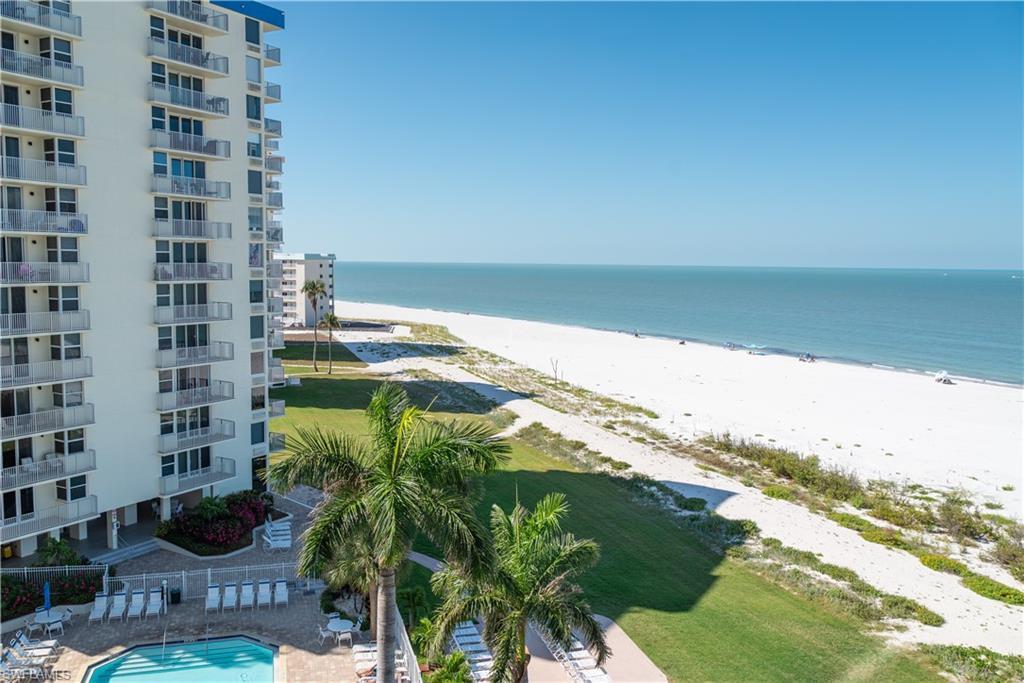 Image 3: View of the pool and Gulf beach from the balcony