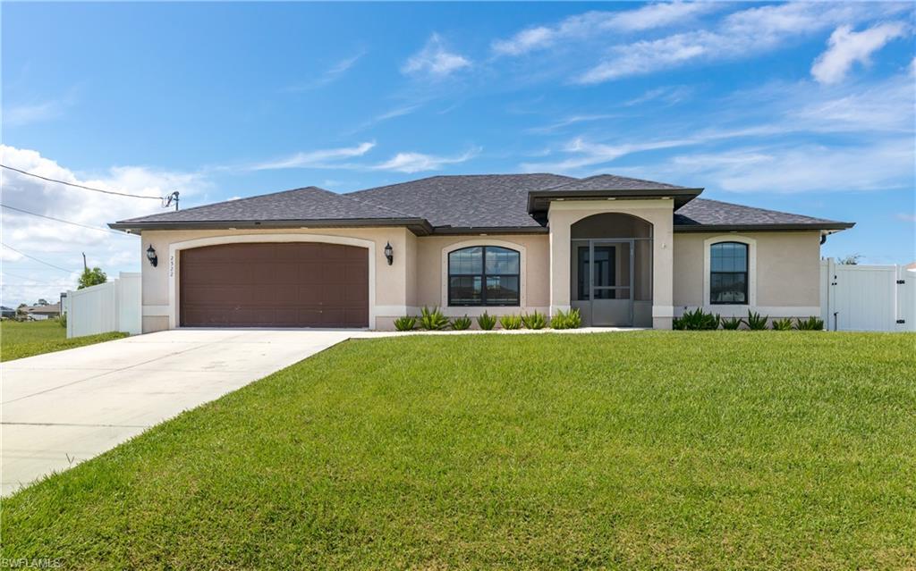 Image 1: Contemporary stucco exterior with a dark shingle roof, arched entryway, screened front porch, and a two-car garage