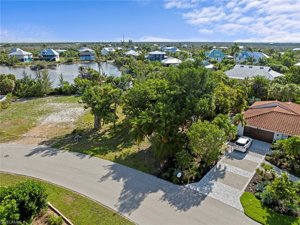 Image 3: Residential lot featuring mature trees and a clear building area