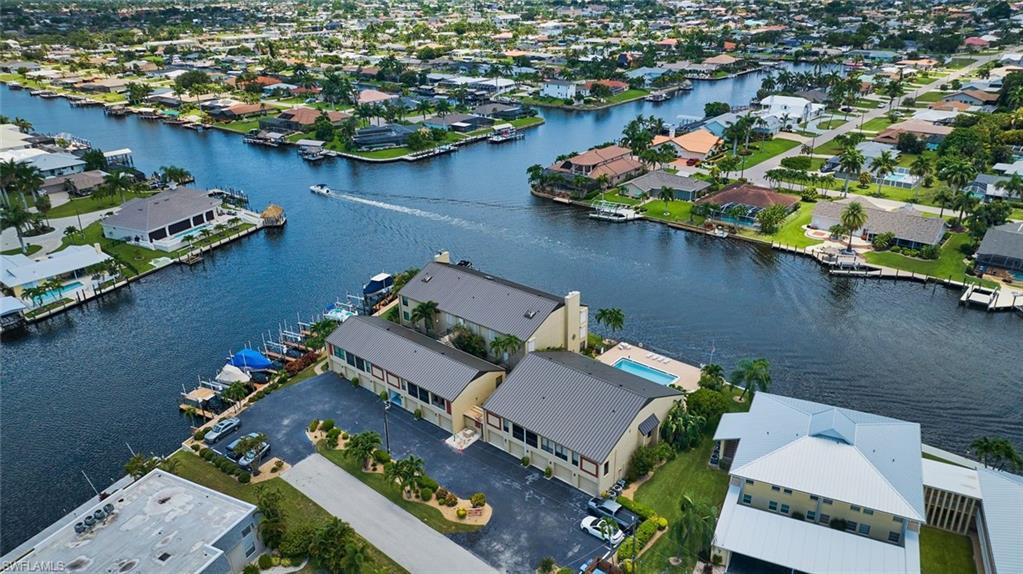 Image 2: Aerial View showing the intersecting canals.  While sitting on your lanai you can watch boats going by all day long!  Incredible sunrises and sunsets daily!